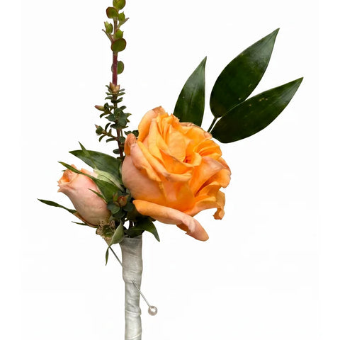 Orange-peach rose boutonniere with wrapped stem and greenery by Florent Floral Newmarket
