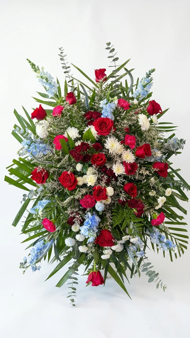 Blue & Red Standing Spray, hand-arranged by Florent Floral for same-day sympathy flower delivery in Newmarket Ontario