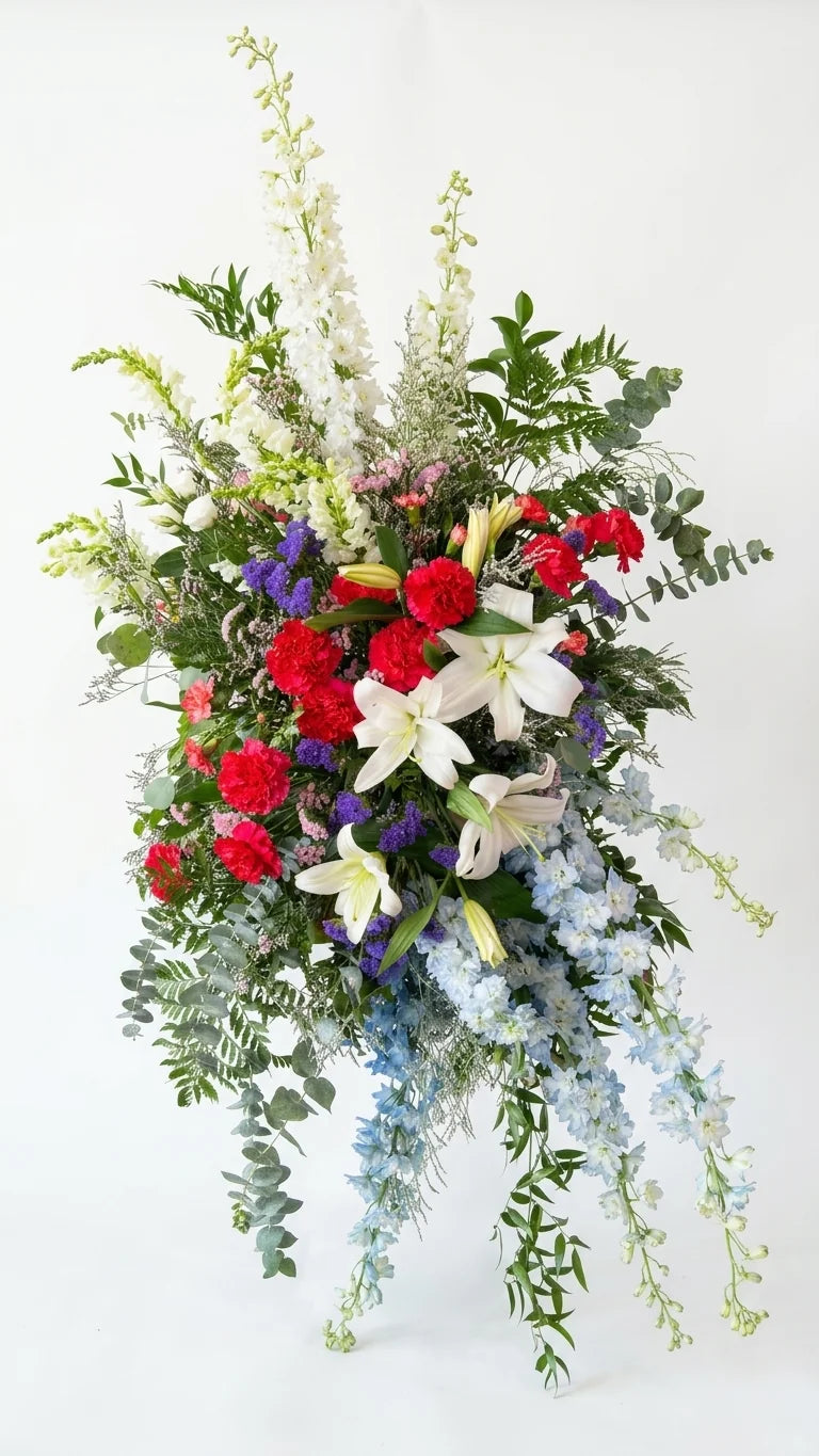 Blue & White Standing Spray, hand-arranged by Florent Floral for same-day sympathy flower delivery in Newmarket Ontario