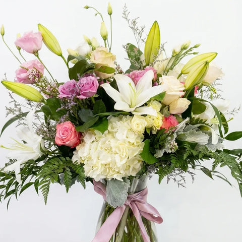 Lily Sympathy Arrangement, hand-arranged by Florent Floral for same-day sympathy flower delivery in Newmarket Ontario