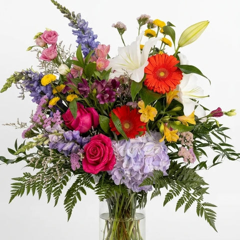 Rainbow Colour Sympathy Arrangement, hand-arranged by Florent Floral for same-day sympathy flower delivery in Newmarket Ontario